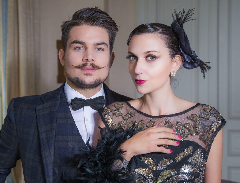 Couple posing in Great Gasby style dress code