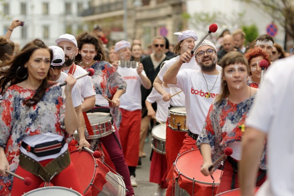 people playing drums and promoting an event