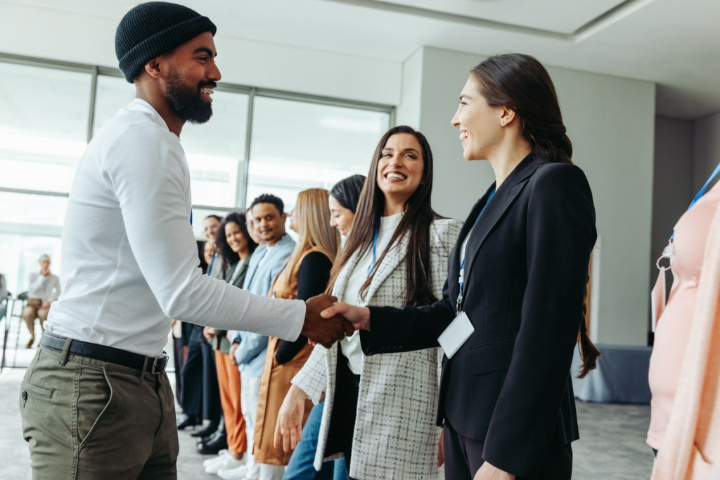 greeting the sponsors at a corporate event