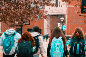 young people Wearing Backpacks in a city. 