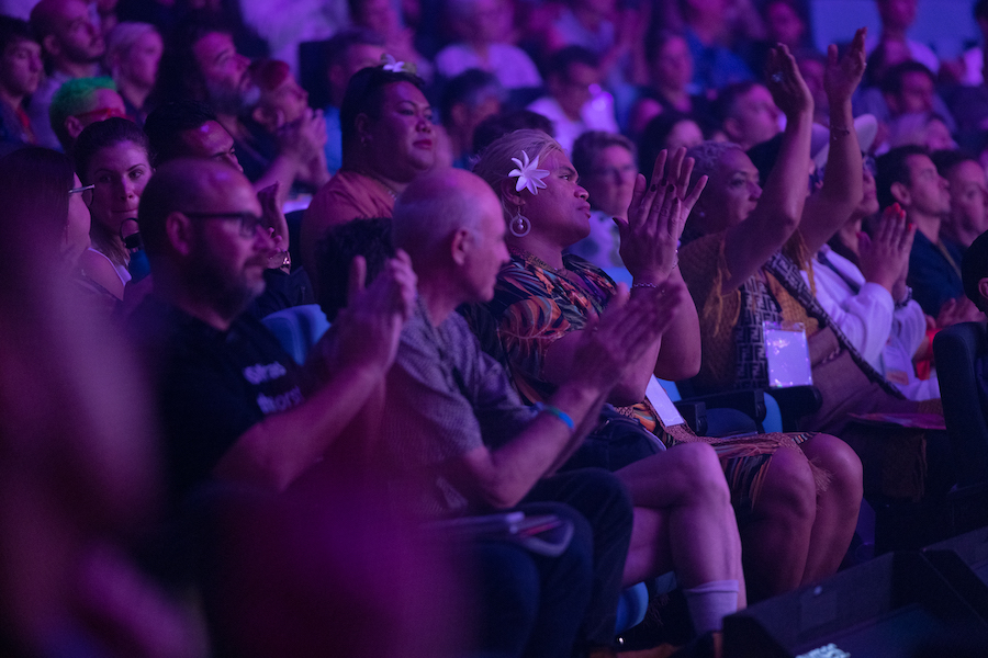 Changemakers sit clapping in the audience at the Sydney WorldPride Human Rights Conference, leading the way for LGBTQIA+ communities in the Asia Pacific region.