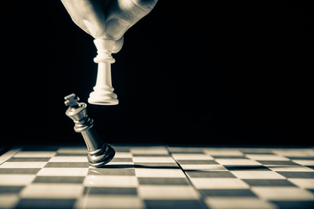 White king taking down black king on an otherwise empty chess board