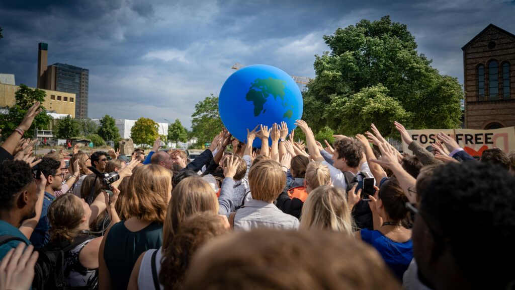 a group of people demonstrating in support of sustainability goals