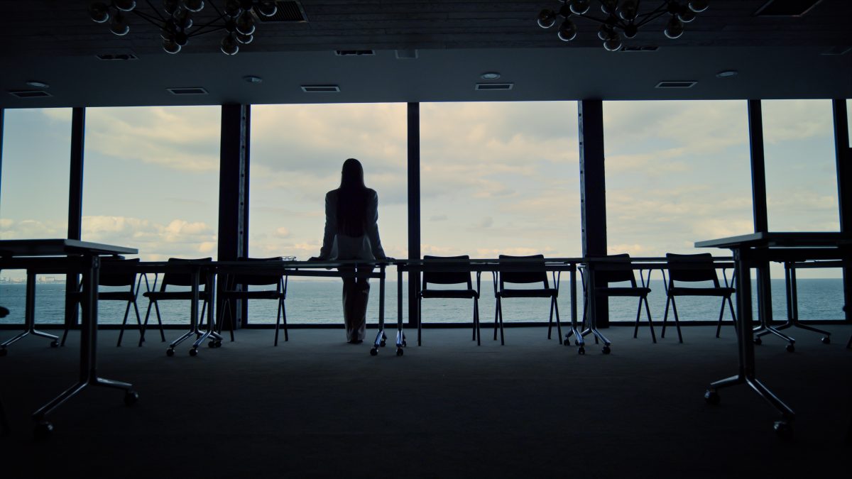 Business woman in an empty conference room