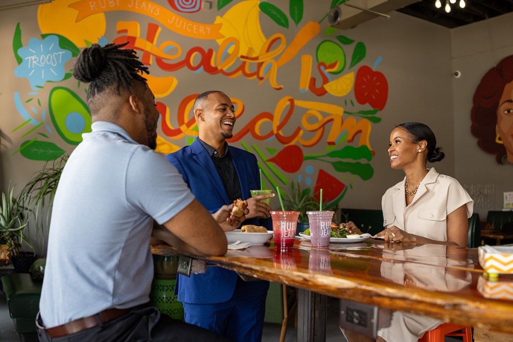 Three people gathered at Ruby Jean's Juicery in Kansas City.