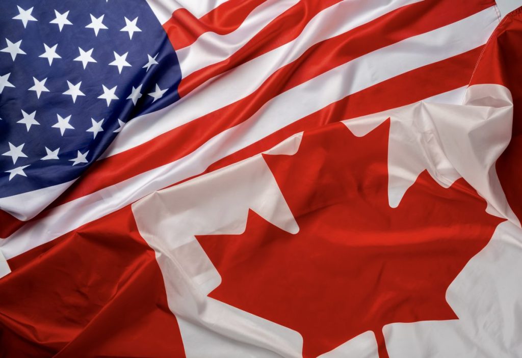 Canadian flag and U.S. flag