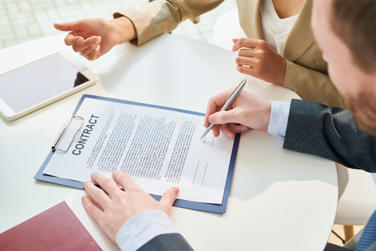 People signing a contract