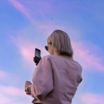 woman on cell looking at sky